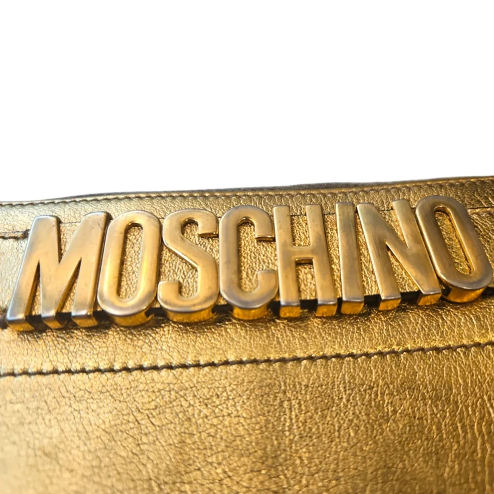 MOSCHINO | Metallic Gold Embossed Logo Zip Wallet